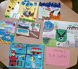 Prace plastyczne przedstawiające Warszawę, Poznań oraz inne miasta.
