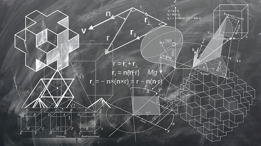 grafika symbolizująca matematykę i fizykę teoretyczną. Tablica zapisana kredą.
