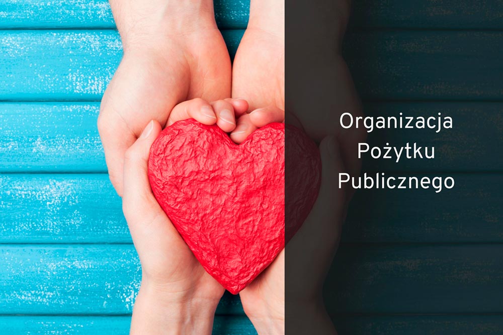 Grafika z sercem na dłoniach.