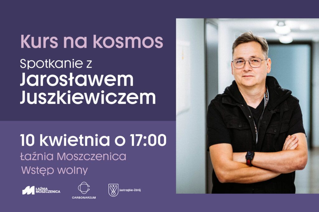Jarosław Juszkiewicz w czarnej koszulce z założonymi rękami